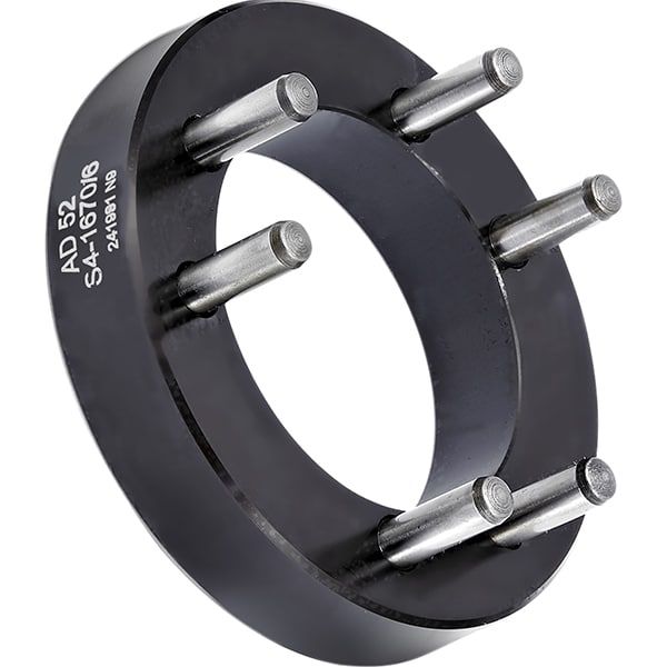 Royal Boring Fixture QG-65 44083, angled view of a black ring-shaped fixture with steel pins standing out from its face