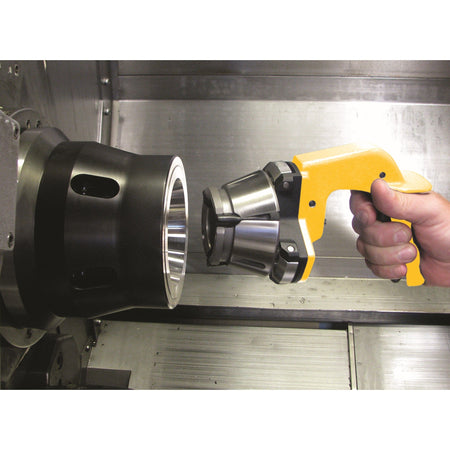 Royal Quick-Grip Collet Installation Tool 44098, hand holding the tool with a collet in front of a chuck inside a machine